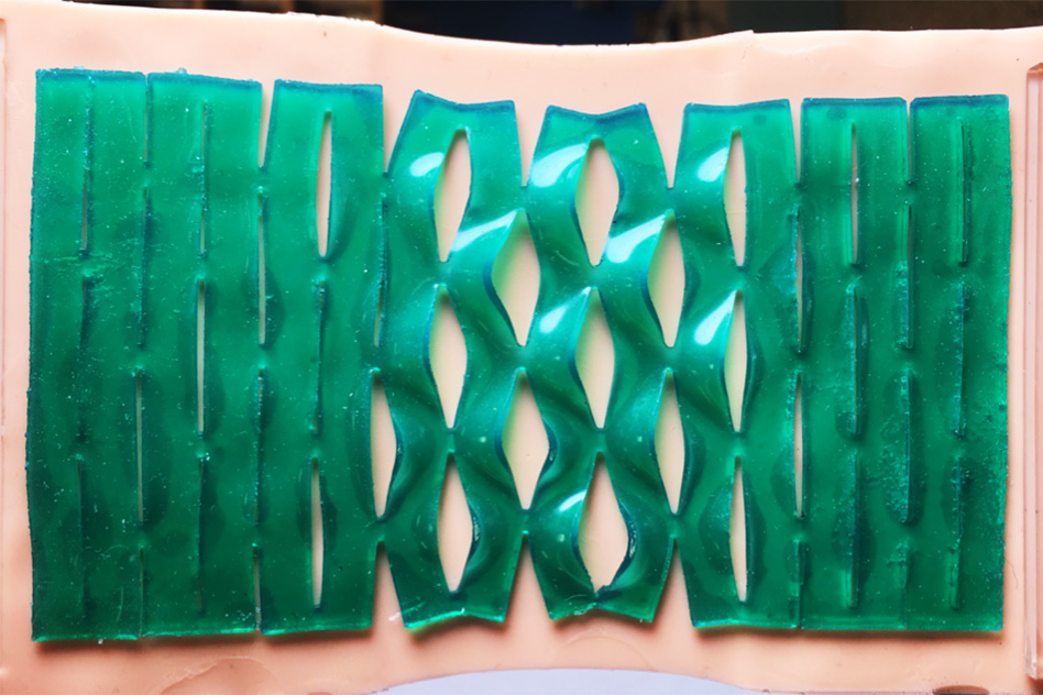 Kirigami adhesives: from medical bandages to wearable electronics